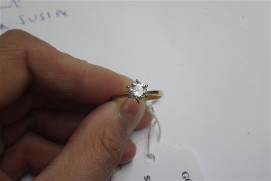 A gold and solitaire diamond ring, size M.